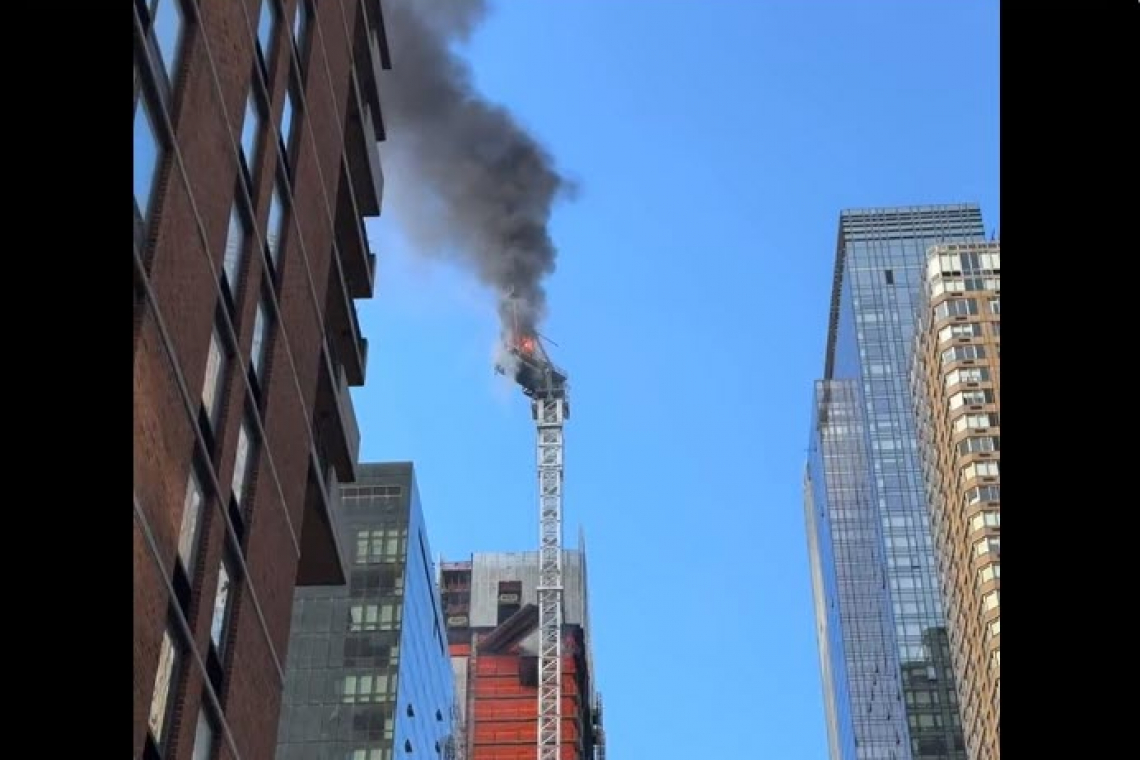 CRANE CATCHES FIRE; COLLAPSES - NEW YORK CITY